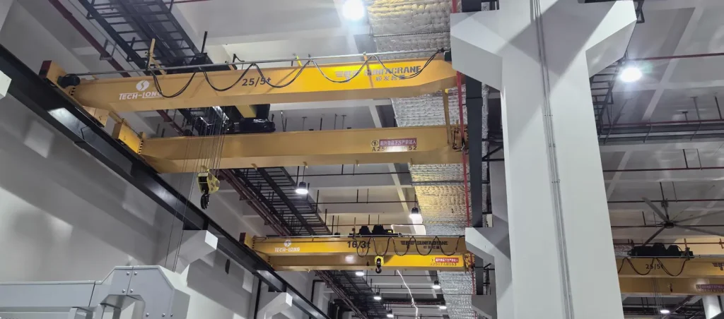 25/5t and 16/3t overhead cranes in adjacent factory bays